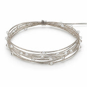 A coiled coil of battery-operated warm white LED fairy lights on a white background - thumbnail number 2