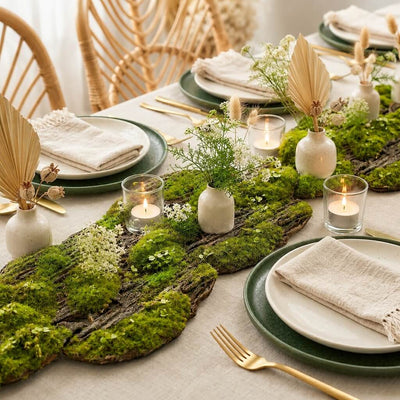 Foam moss tree bark with candles and dried palm leaves on a table - thumbnail number 4