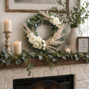 Pampas grass and white rose wreath displayed on a mantelpiece with candles and greenery - thumbnail number 9