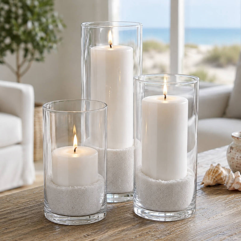 Lit candles in glass cylinders with natural white sand - thumbnail number 7