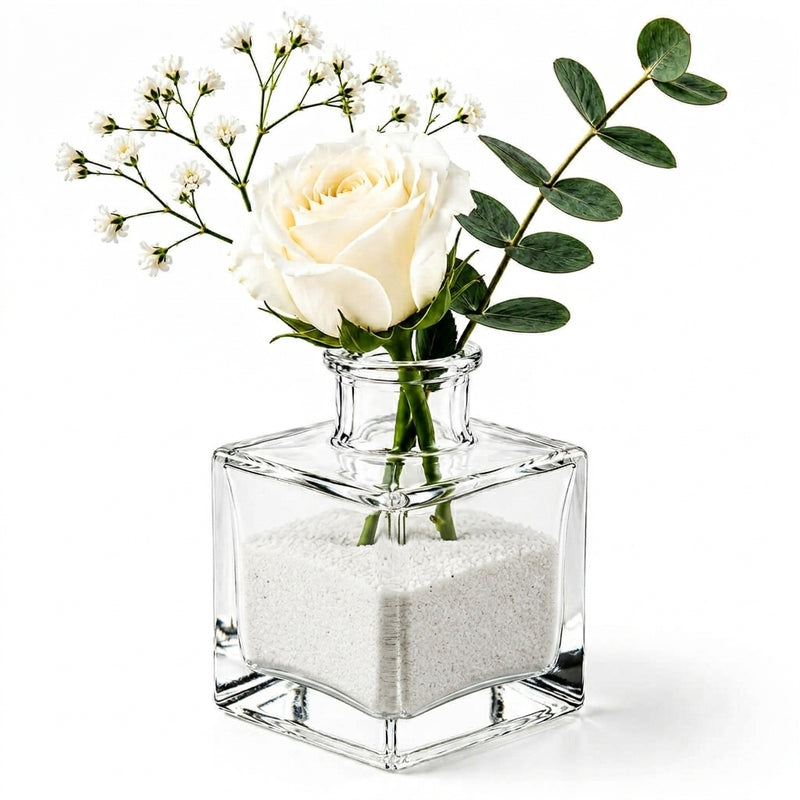 White rose and greenery in a glass vase with natural white sand - thumbnail number 2