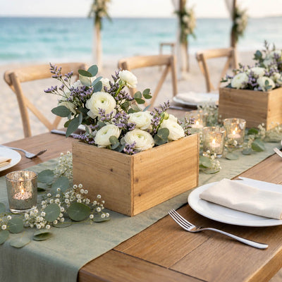 Wooden berry box filled with white flowers on a beach wedding table - thumbnail number 4