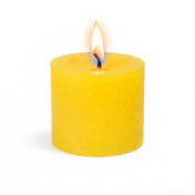 A single, lit yellow votive candle isolated on a solid white background - thumbnail number 4