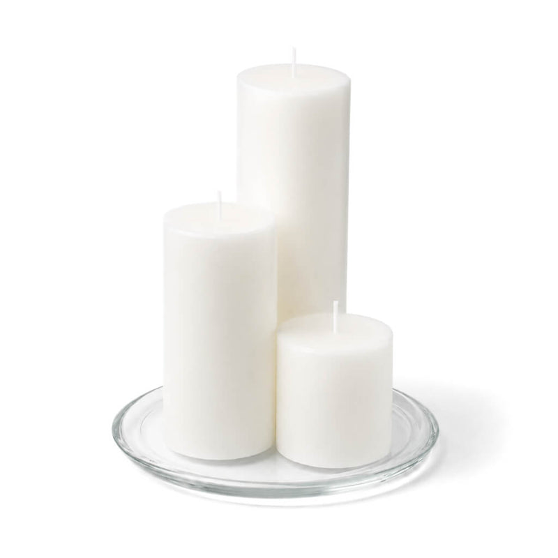 8" Round Glass Pillar Plate with three white pillar candles on a white background - thumbnail number 2