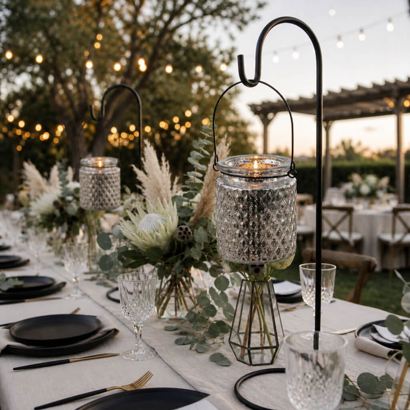 Candlelit outdoor reception table with hanging mercury holders and floral accents - thumbnail number 4
