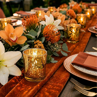 Amber Gold Mercury Votive Holders on a terracotta velvet runner with lilies and pincushions - thumbnail number 4