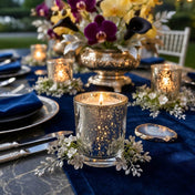 Silver Mercury Votive Holders with lit candles on a navy runner with orchids and agate accent - thumbnail number 6