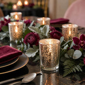 Silver Mercury Votive Holders with lit candles on a dark table runner with burgundy flowers - thumbnail number 4