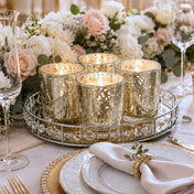 Four glowing Metallic Gold Mercury Votive Holder pieces arranged on a mirrored vanity tray - thumbnail number 6