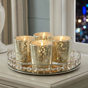 A home decor table setup showcasing a clustered set of Metallic Gold Mercury Votive Holder cups - thumbnail number 7