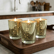A trio of glowing Metallic Gold Mercury Votive Holder cups staging a cozy kitchen counter - thumbnail number 8