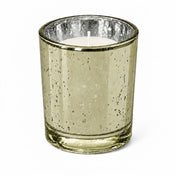 An upscale dining table setup showcasing a burning Metallic Gold Mercury Votive Holder cup - thumbnail number 2