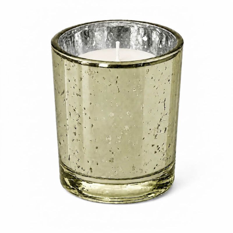 An upscale dining table setup showcasing a burning Metallic Gold Mercury Votive Holder cup - thumbnail number 2