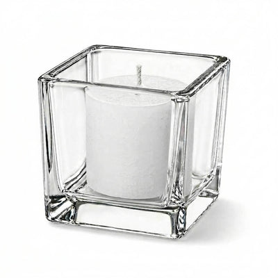 Unlit white candle in clear square glass holder on white background - thumbnail number 2