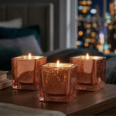 Set of glowing rose gold mercury square votive holders on a wooden table at night - thumbnail number 8