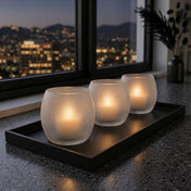 Three frosted glass candle holders on a black tray against a nighttime city skyline backdrop - thumbnail number 7