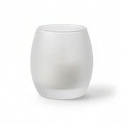 Frosted glass votive holder containing a white candle against a plain white background - thumbnail number 2
