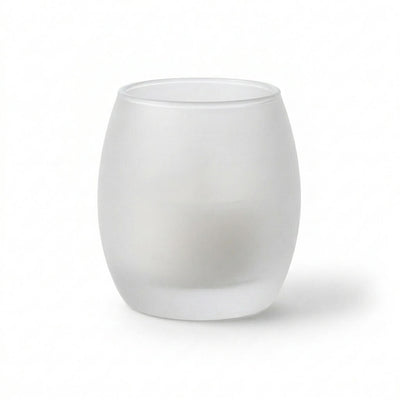 Frosted glass votive holder containing a white candle against a plain white background - thumbnail number 2