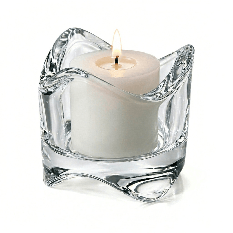 Clear glass candle holder with a white candle on a white background - thumbnail number 5
