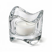 Clear glass swirl-top tealight holder with a white candle on a white background - thumbnail number 2