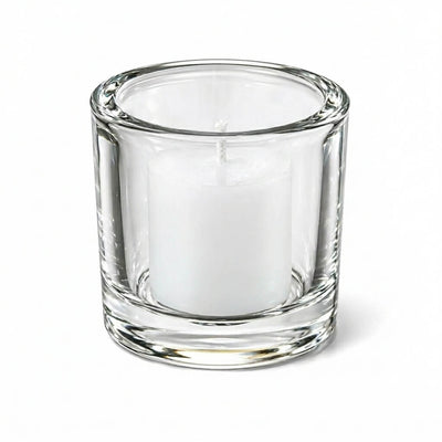 Clear glass candle holder with white votive candle on white background - thumbnail number 4