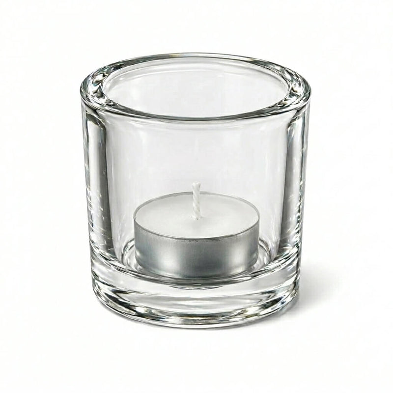 Clear glass candle holder with white tealight candle on white background - thumbnail number 2