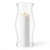 Lit white pillar inside a clear glass Hurricane Pillar Candle Lamp over a solid white surface - thumbnail number 3