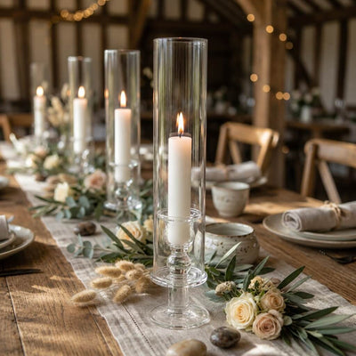 White vigil candles in glass holders on rustic floral dinner table centerpiece - thumbnail number 5
