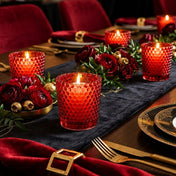 Red hobnail votive holders with lit candles and red floral centerpiece - thumbnail number 5