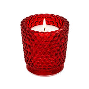 Red hobnail glass votive holder with glowing candle on white backdrop - thumbnail number 3