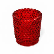 Red hobnail glass votive holder on white backdrop - thumbnail number 1