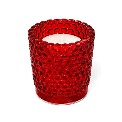 Red hobnail glass votive holder with white candle on white background - thumbnail number 2