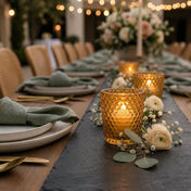 Amber hobnail votive candles on elegant floral dinner table with warm string lights - thumbnail number 6
