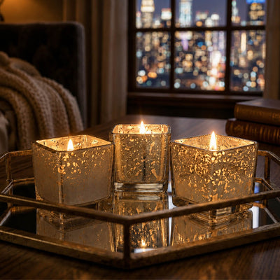 Metallic gold mercury square votive holders glowing on a tray with city view background - thumbnail number 8