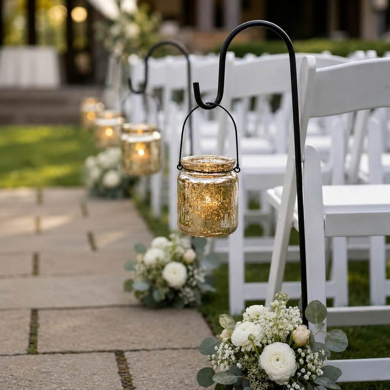 Gold mercury glass hanging holders lining a wedding aisle with white chairs and floral bouquets - thumbnail number 5