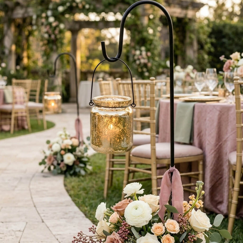 Gold mercury glass hanging holders lining a garden wedding aisle with floral arrangements and ribbons - thumbnail number 3
