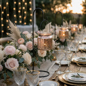 Rose gold hanging candle holders with blush floral decor on an elegant outdoor table - thumbnail number 4