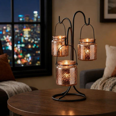 Rose gold mercury hanging candle holders on a modern table with city lights background - thumbnail number 6