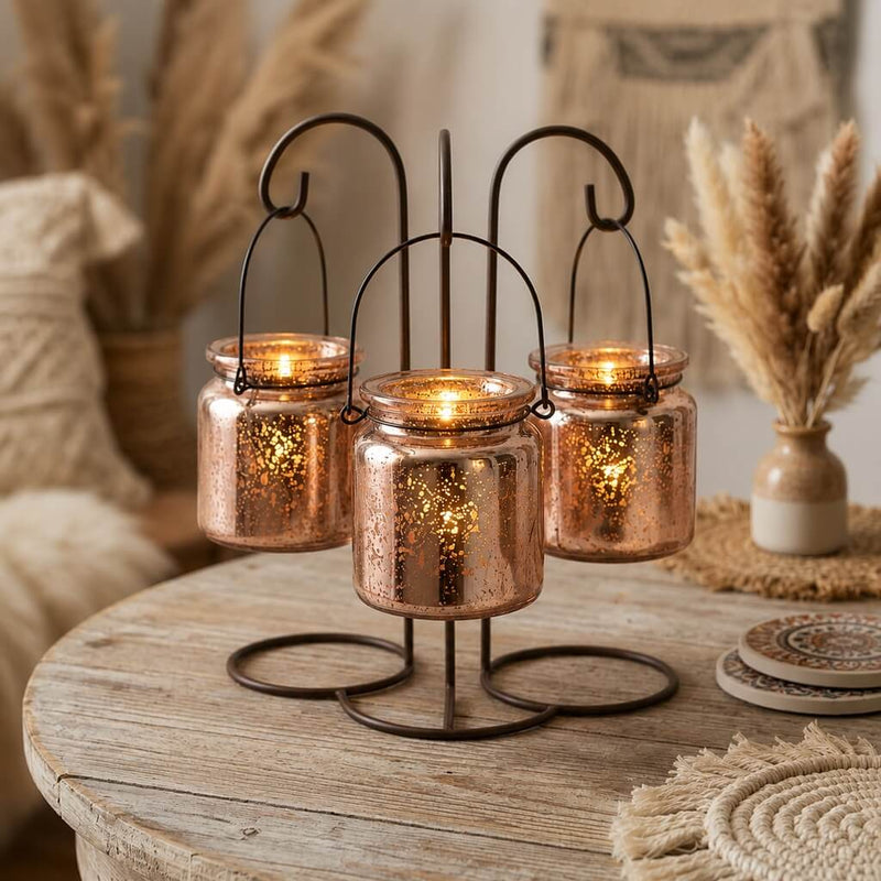Rose gold mercury hanging candle holders on a rustic table with warm boho decor - thumbnail number 7