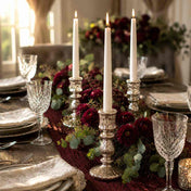 Candlelit dining table with white candles and burgundy flower garland - thumbnail number 3