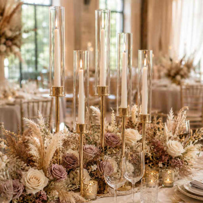 White taper candles with floral centerpiece and gold candle stands - thumbnail number 4