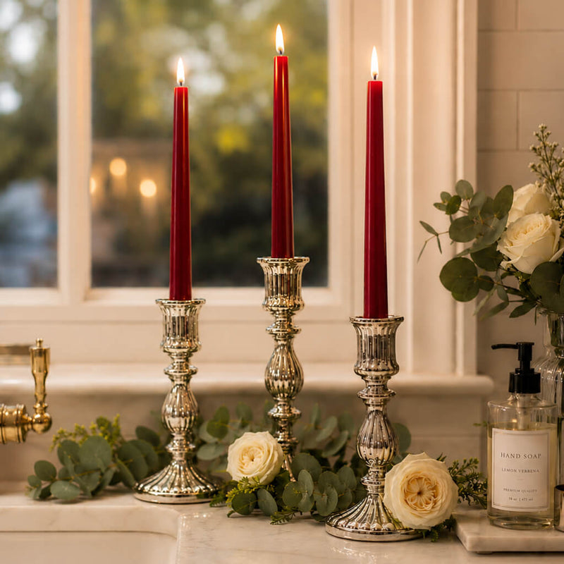 Red taper candles in silver holders with white roses by window - thumbnail number 7