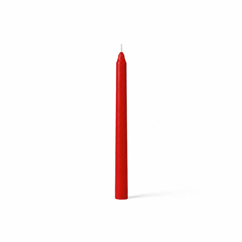 Unlit red taper candle standing on white background - thumbnail number 1
