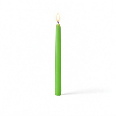 Single green taper candle with flame on white surface - thumbnail number 2