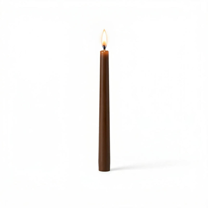 Single brown taper candle with flame on white background - thumbnail number 2