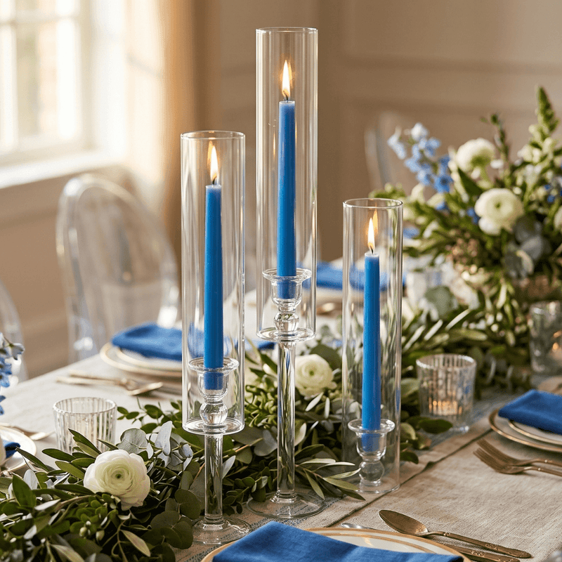 Elegant table setting with blue candles and white floral arrangements - thumbnail number 3