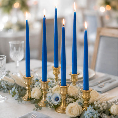 Lit blue taper candles with gold candlesticks and white flowers - thumbnail number 5