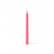 Single pink taper candle with flame on white backdrop - thumbnail number 2