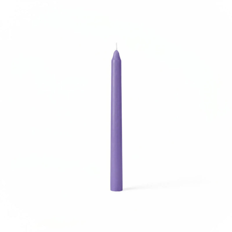 Single lavender taper candle on white backdrop - thumbnail number 1