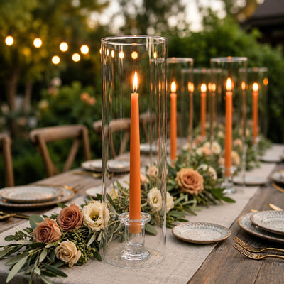 Orange taper candles in glass cylinder vases on a romantic outdoor tablescape - thumbnail number 5